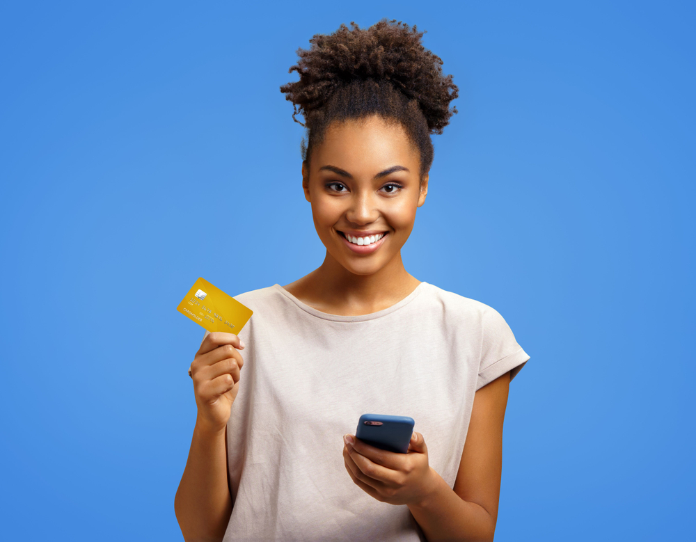 Person holding card to represent payment gateways for your ecommerce business